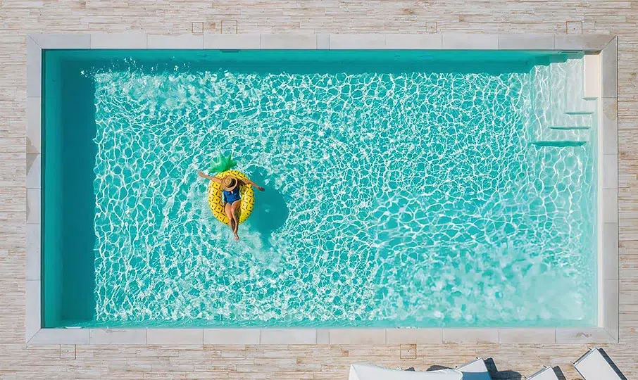Manufacturer illustration of a pool with teal water